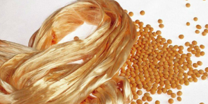 How are metal fibers embedded into fabrics?